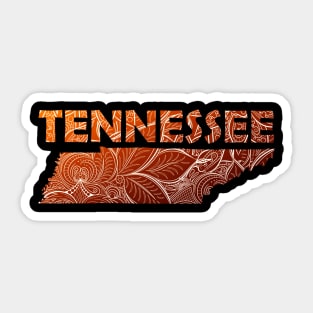 Colorful mandala art map of Tennessee with text in brown and orange Sticker